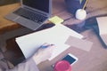 Businesswoman with documents paper sheet in loft modern office, working on laptop computer. Team working, business people. Royalty Free Stock Photo