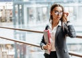 Businesswoman with documents for work. Student girl with folders with documentation. An officer will collect information