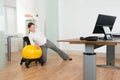 Businesswoman Doing Fitness Exercise On Pilates Ball Royalty Free Stock Photo