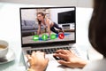 Businesswoman Doing Video Calling With Yoga Trainer