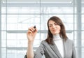 Businesswoman drawing with marker