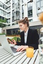 Businesswoman drinking coffee at cafe and hold smartphone Royalty Free Stock Photo