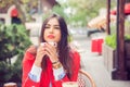 Businesswoman drinking enjoying coffee in a cafe