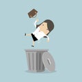 Businesswoman dropped into trashcan layoff concept.