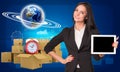 Businesswoman with Earth and heap of cardboard Royalty Free Stock Photo