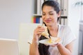 Businesswoman eating sandwich in lunch break Royalty Free Stock Photo