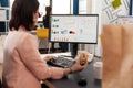 Businesswoman eating tasty sandwich having meal break working in business company Royalty Free Stock Photo