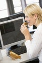 Businesswoman Enjoying Sandwich During Lunchbreak Royalty Free Stock Photo