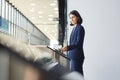 Businesswoman Entering Office Building through Automatic Gate