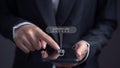Businesswoman entering security code in mobile phone. Concept of protection of personal information and transactions on internet Royalty Free Stock Photo
