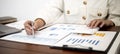 Businesswoman examining company finance documents in the office. Royalty Free Stock Photo