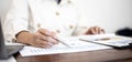 Businesswoman examining company finance documents in the office. Royalty Free Stock Photo