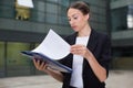 Businesswoman is examining documents