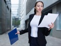 Businesswoman is examining documents