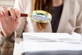 Businesswoman Examining Invoices