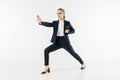 businesswoman exercising karate in suit