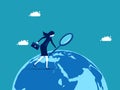 Businesswoman exploring the world with a magnifying glass. business concept vector illustration