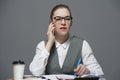 A businesswoman in eyeglasses making a call Royalty Free Stock Photo