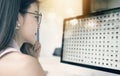 businesswoman with eyeglasses sitting at her workplace and looking at pc screen Royalty Free Stock Photo