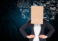 Businesswoman face covered with cardboard box against business concept