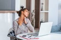 Businesswoman feeling pain in neck after sitting at the table with laptop. Tired female suffering of office syndrome because of Royalty Free Stock Photo