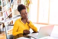 Businesswoman feeling pain in neck after sitting at the table with laptop. Tired female suffering of office syndrome because of Royalty Free Stock Photo