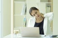 Businesswoman feeling pain in neck, tired woman suffering of office syndrome after long hours work. Health concept Royalty Free Stock Photo