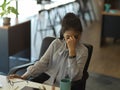 Businesswoman feeling upset while working in office room