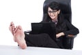 Businesswoman with Feet Up on a table