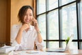 Businesswoman or female accountant enjoy talking on the phone with someone Royalty Free Stock Photo