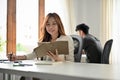 Businesswoman or female secretary working at her office desk Royalty Free Stock Photo