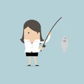 Businesswoman fishing a big fish. Royalty Free Stock Photo