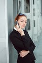 Businesswoman focused on mobile conversation