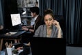 Businesswoman focusing computer with coworker working at back side. Infobahn. Royalty Free Stock Photo