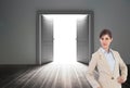 Businesswoman in front of a generated door Royalty Free Stock Photo