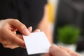 Businesswoman give her business card to her new partner closeup