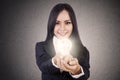 Businesswoman give lit lightbulb Royalty Free Stock Photo