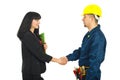 Businesswoman gives handshake with worker