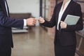 Businesswoman giving business card to client in office Royalty Free Stock Photo