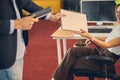 Businesswoman giving documents to male colleague at work Royalty Free Stock Photo