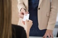 Businesswoman giving her businesscard to her partner Royalty Free Stock Photo