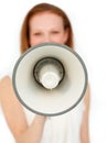 Businesswoman giving instructions with a megaphone Royalty Free Stock Photo