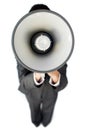 Businesswoman giving instructions with a megaphone Royalty Free Stock Photo