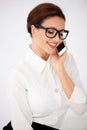 Businesswoman in glasses chatting on a mobile