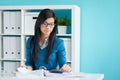 Businesswoman with glasses in office Royalty Free Stock Photo