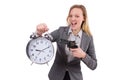 Businesswoman in gray suit holding alarm clock