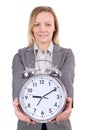 Businesswoman in gray suit holding alarm clock Royalty Free Stock Photo