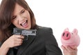 Businesswoman with gun pointing at piggy bank Royalty Free Stock Photo