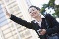 Businesswoman Hailing A Cab Royalty Free Stock Photo