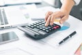 Businesswoman hand doing finances and calculate on desk about cost at home office. Business financing accounting banking concept. Royalty Free Stock Photo